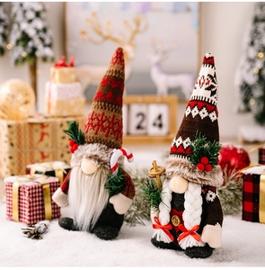 Detail of Christmas gnomes with knitted hats and candy cane in a festive holiday scene