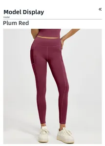 Detail view of high waist yoga leggings in plum red with side pockets and flat seams