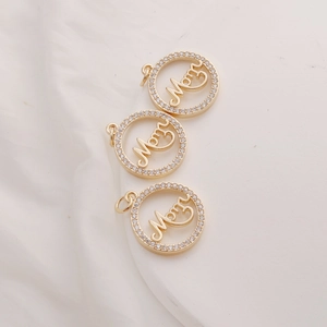 Close-up of three 14K gold plated Mom pendants with sparkling cubic zirconia inlay detail