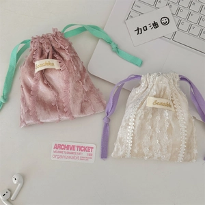 Lace-trimmed velvet drawstring pouches in pink and cream for lipstick or earbuds storage