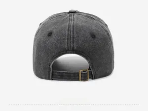 Rear view of washed gray baseball cap showing the adjustable bronze metal buckle