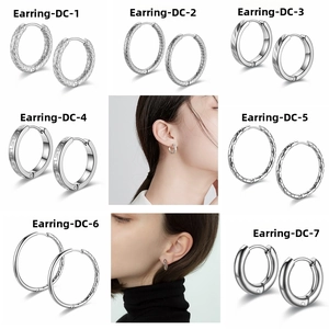 Detailed collection of titanium steel hoop earrings in polished and textured finishes