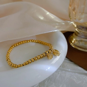 18k gold plated stainless steel beaded bracelet with lotus seed and bud charms