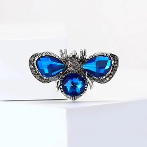 Cartoon honey bee brooch with deep blue crystals and rhinestones on silver base