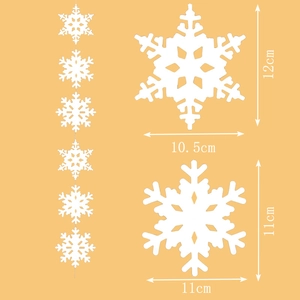 White snowflake garland and hanging decorations for Christmas tree and festive window display
