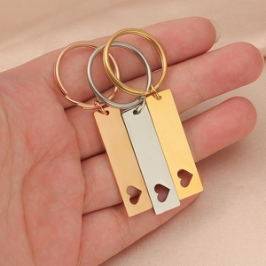 Polished stainless steel rectangular keychains with heart cutout in gold, silver, and rose gold