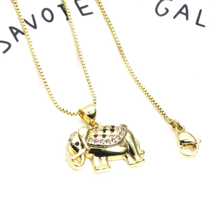 Detailed view of golden elephant pendant with colorful zircon stones and box chain