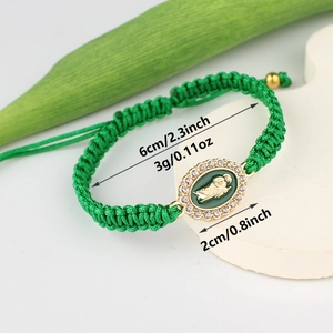 Detailed view of handmade green woven Virgin Mary bracelet with size and weight specs