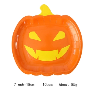 Detailed view of 7-inch pumpkin face paper plates set of 10 for Halloween party table décor