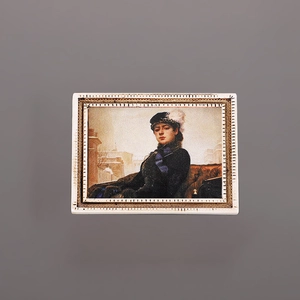 Close-up of vintage resin magnet featuring a 3D oil painting portrait in gold frame