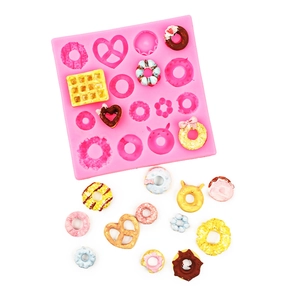 Pink silicone mold for mini donuts and pretzels with colorful clay resin examples