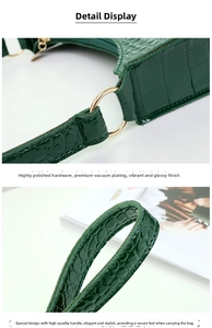 Detail of dark green crocodile texture bag showing gold hardware and reinforced handle