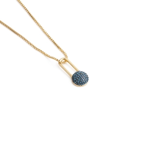 Detail of gold box chain necklace featuring a U-shaped pendant with pavé blue zircons