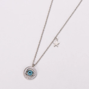 Detail shot of silver stainless steel necklace with blue evil eye pendant and star