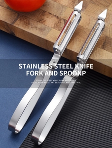 Close-up of serrated stainless steel vegetable peeler blades on a wooden board
