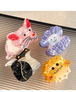 Collection of animal-shaped acetate hair claws including pink mouse and purple shell styles