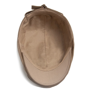 Deep beige PU leather newsboy cap with soft fabric lining and detailed sweatband design