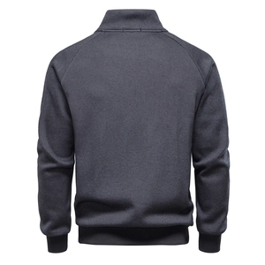 Detail view of the back of a fleece-lined sweatshirt with ribbed cuffs and stand collar