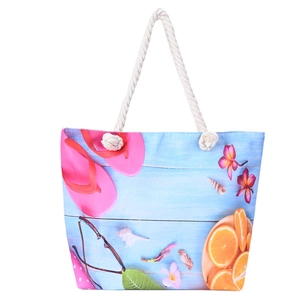 Détail du sac de plage en toile avec poignées en corde et imprimé estival coloré