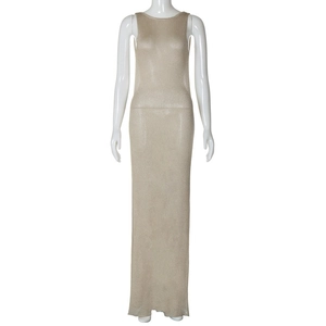 Detailed close-up of beige sleeveless knitted long maxi dress with fine mesh texture