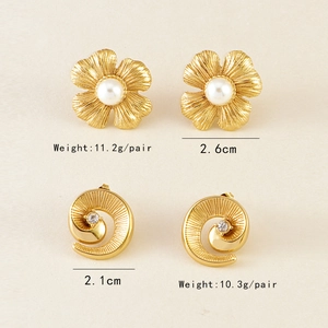 Detail view of gold flower pearl earrings and spiral crystal studs with size and weight specs