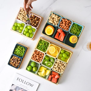 Set of colorful ceramic snack bowls with bamboo trays in 4, 6, and 9 compartment layouts