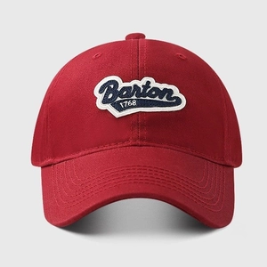 Detailed view of dark red cotton baseball cap with Barton 1768 vintage embroidery