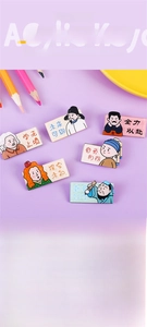 Detailed close-up of motivational acrylic cartoon character pins and brooches