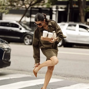 Elegant military green faux suede bodycon midi skirt with matching jacket on model