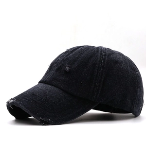 Distressed black washed denim baseball cap with New York embroidery and vintage ripped details
