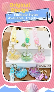 Detailed set of five colorful acrylic seashell keychains with liquid glitter sand