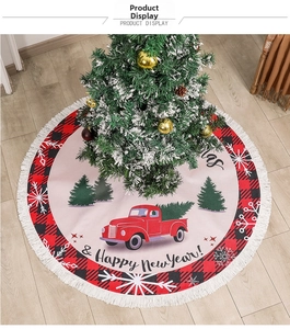 Detail of burlap Christmas tree skirt with red buffalo plaid edges and vintage truck design