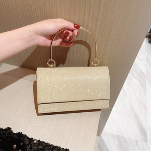Bolso de noche dorado con lentejuelas y asa redonda metálica para fiestas de gala