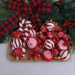 18-piece red and white Christmas tree ornament set with candy and cane shapes in a tray