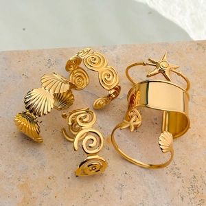 Set of 18K gold-plated stainless steel ocean theme wave bangles with seashell and starfish