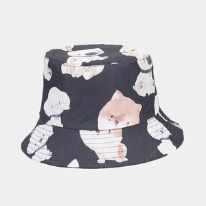 Detail of grey bucket hat with colorful hand-painted cartoon dog patterns and stitching