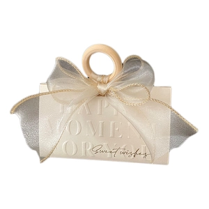 Elegant champagne triangle wedding gift box with wooden handle and gauze bow detail