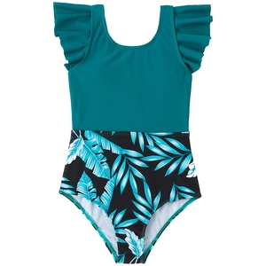 Detail of girls one-piece swimsuit with ruffled sleeves and tropical leaf print pattern