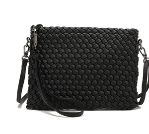 Close-up of black woven leather texture with high-quality metal buckle and strap