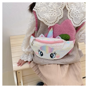 Detail view of cute unicorn waist bag with rainbow sequins and embroidery on a child model