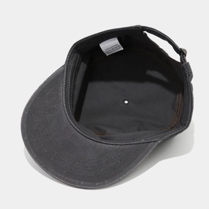 Internal detail of dark grey cotton cadet cap showing inner sweatband and metal buckle