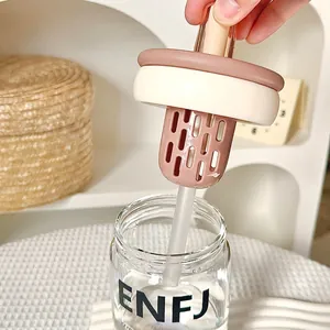 Minimalist glass tea infuser cup with ENFJ print and cream-colored lid for students