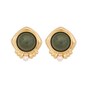 Vintage gold earrings with dark green stones and white pearls on white background