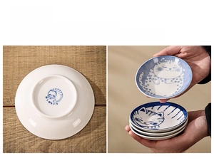 Detail of non-slip unglazed bottom and stackable ceramic cat sauce dishes with cat prints