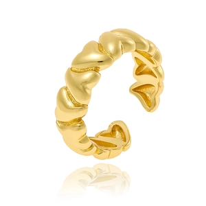 Detailed view of gold plated twisted geometric ring with sleek polished finish and reflection