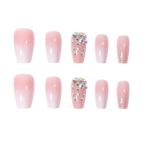 Short ballet pink gradient press-on nails with glitter and iridescent rhinestones
