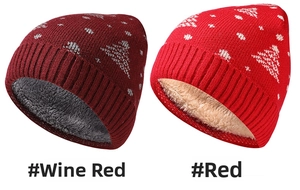 Close-up of thick fleece lining and Christmas tree pattern on festive knit beanies