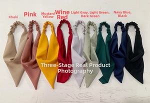 Flat lay of colorful chiffon elastic headbands in nine different soft shades