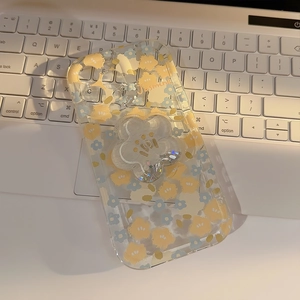 Close-up of floral iPhone case with Jasmine text and matching glitter M flower stand
