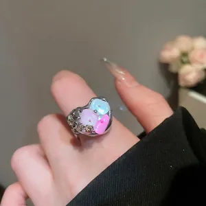 Irregular shell flower open ring with pink and blue heart accents and pavé crystals